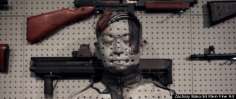 Huffington Post: Liu Bolin's Gun Rack Performance