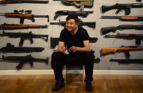 Complex Magazine: Liu Bolin Performs "Gun Rack" At Eli Klein Fine Art in New York